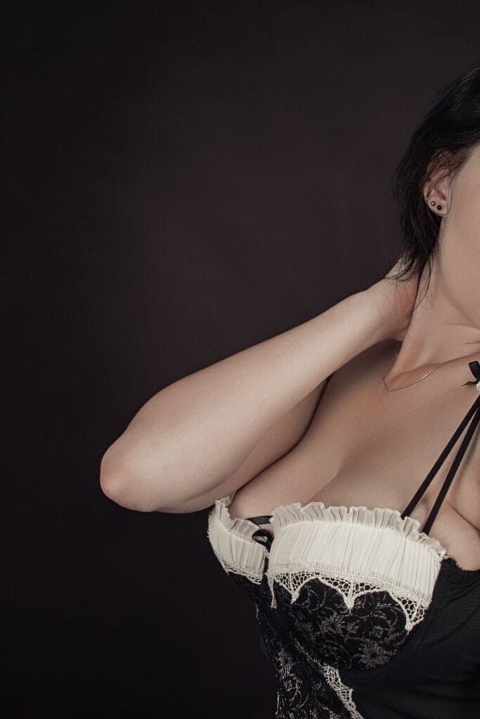 ESCORT SERVICE IN ROHINI Sophisticated studio portrait of a woman showcasing elegance and style.